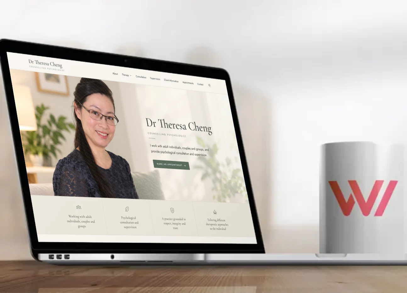 Laptop on a desk showing the new Dr Theresa Cheng counselling psychologist website designed by Web Design MK, next to a Web Design MK mug